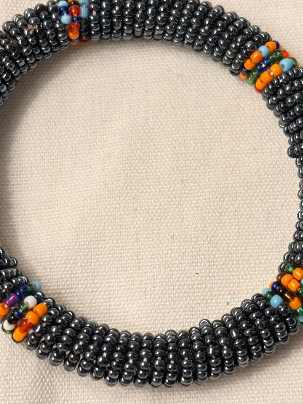 Handcrafted Hematite Beaded Bangle Bracelet with Orange Accent